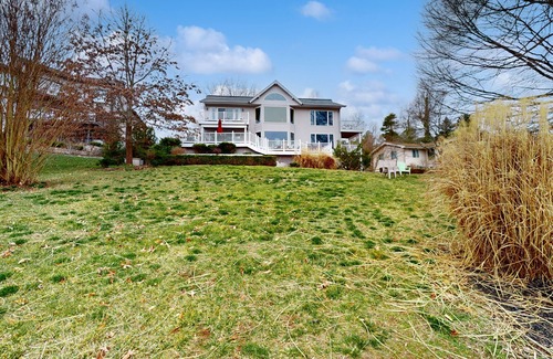 Livingston House | Lakefront retreat with views, hot tub, kid's play area, dock & fiber internet