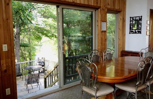 Tomah House | Lakefront Vacation Rental with a Deck and Hot Tub near Wisconsin Dells