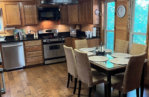 Greers Ferry Cabin | Lakeside Lodge for family fun with game room and covered deck! Fish & Swim!