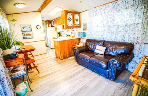 Eddyville Cabin | Lakeside Place 1 (Sleeps 1-6) - Tiny living space with a queen bed, and 3 twin beds perfect for kids