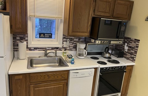 Gilford Condo | Lakeview condo with tennis, sauna, shared pool & a private beach