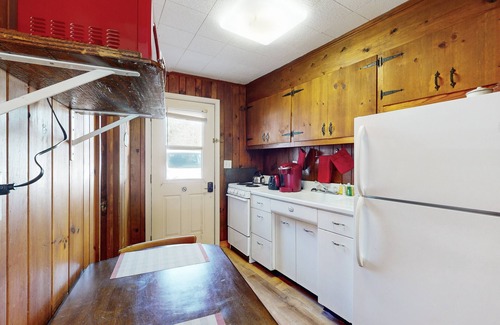 Flat Rock Condo | Lakeview studio condo with pool, fire pit, canoes & paddle boats, tennis, & WiFi