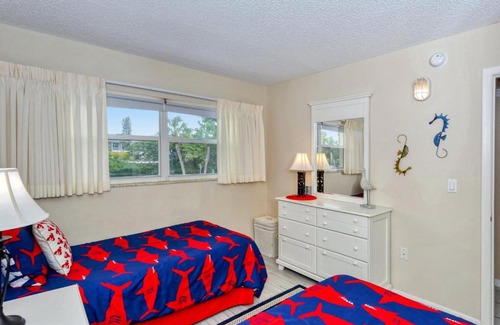 Longboat Key Apartment | LaPlaya 201E Nestled in the palms just steps from the pool