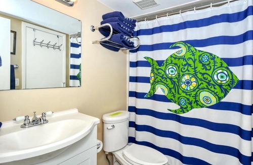 Longboat Key Apartment | LaPlaya 201E Nestled in the palms just steps from the pool