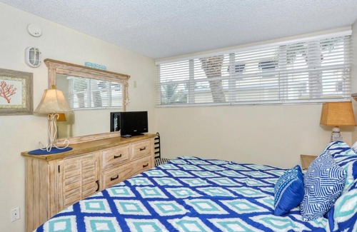 Longboat Key Apartment | LaPlaya 201E Nestled in the palms just steps from the pool