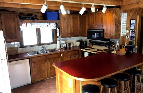 Bryant Pond House | Large comfortable log house with great lake swimming and kayaking