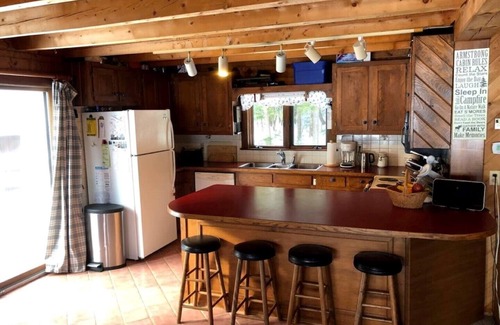 Bryant Pond House | Large comfortable log house with great lake swimming and kayaking
