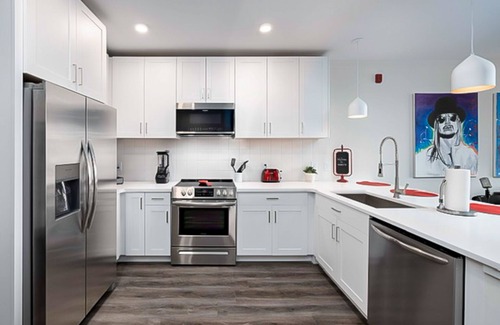 Rolling Mill Hill Apartment | Legends at the Muse - artful condo with city-view balcony, full kitchen, AC & gym