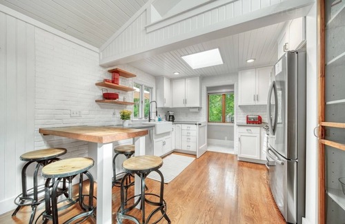 Fennville House | Listen to the waves in this charming, two-story home is nestled away on quiet &
