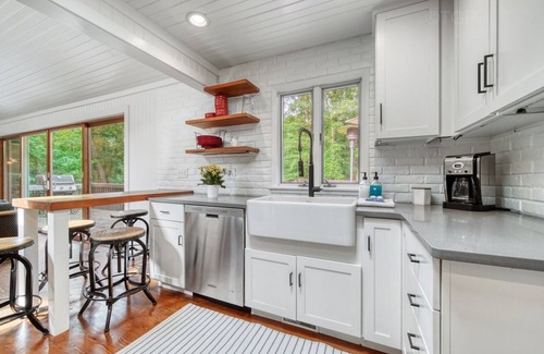 Fennville House | Listen to the waves in this charming, two-story home is nestled away on quiet &