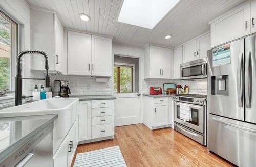 Fennville House | Listen to the waves in this charming, two-story home is nestled away on quiet &
