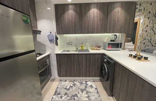 Al Abdali Apartment | Live in the heart of Amman with this luxury one-bedroom suite featuring two balc