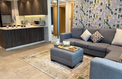 Al Abdali Apartment | Live in the heart of Amman with this luxury one-bedroom suite featuring two balc
