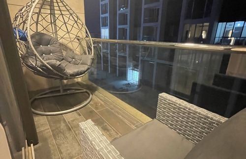 Al Abdali Apartment | Live in the heart of Amman with this luxury one-bedroom suite featuring two balc