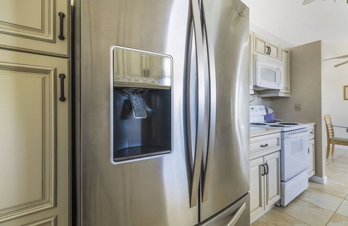 Gardens of Gulf Cove House | Located in an active community w/heated pools, tennis courts and shuffleboard