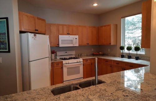 Bellaire Condo | LOCATION LOCATION! Golfers Paradise & ski in/out on the 18th green Cedar River