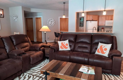 Bellaire Condo | LOCATION LOCATION! Golfers Paradise & ski in/out on the 18th green Cedar River