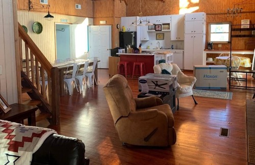Calico Rock House | Lockie Lodge, rustic A frame style home with open concept.