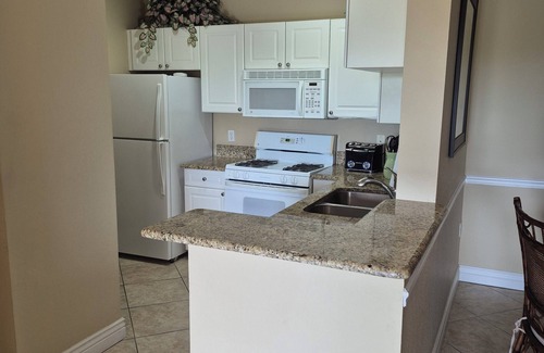 Cove Cay Condo | Lovely 2 BR Waterfront Condo Balcony Grand Venezia
