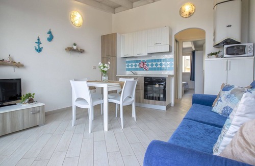 Paduledda Apartment | Lovely apartment for 4 people with A/C, pool, TV, terrace, pets allowed and parking