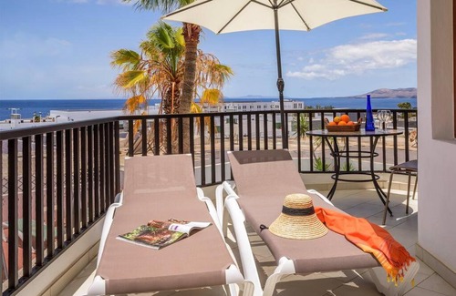 Puerto del Carmen Apartment | Lovely apartment with sea and mountain views