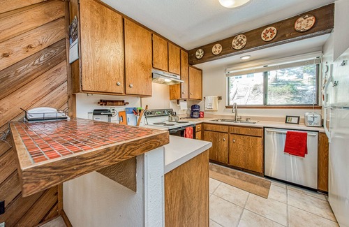 Lakeshore Condo | Lovely condo with free WiFi, pellet stove, large deck, & serene setting