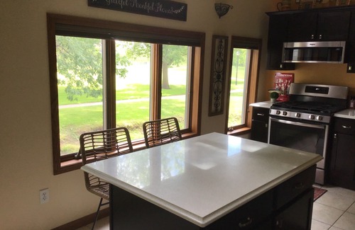 Mishicot Apartment | Lovely riverfront destination featuring open concept loft style. Water view.