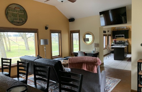 Mishicot Apartment | Lovely riverfront destination featuring open concept loft style. Water view.