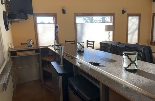 Mishicot Apartment | Lovely riverfront destination featuring open concept loft style. Water view.