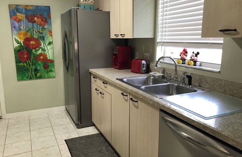 De La Mesa Villa | Lush green patio garden villa, excellent location. Golf cart included!