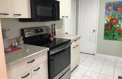 De La Mesa Villa | Lush green patio garden villa, excellent location. Golf cart included!