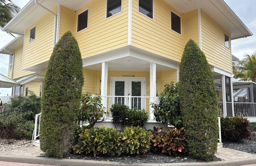 Palm City House | Lush Waterfront Pool Home and Pool house with Pickleball court and Boat dock