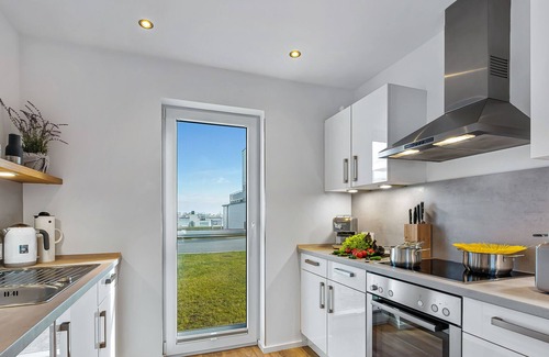 Olpenitz House | Lütthoorn - 1st row on the water, wood-burning stove, sauna, roof terrace, barbecue