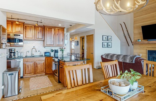 Wildernest Condo | Luxurious top-floor condo with balcony, WiFi, fireplace, great views, & location