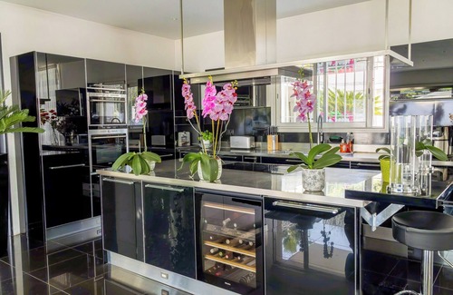 Antibes Villa | Luxury Californian villa in Antibes, red swimming pool and private cinema