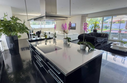 Antibes Villa | Luxury Californian villa in Antibes, red swimming pool and private cinema