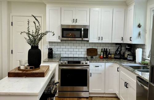 Porter Heights House | Luxury East Nashville home with high end furniture, large yard, and hot tub!