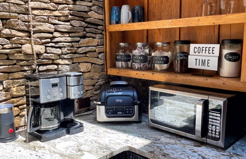 Canton Cabin | Luxury forest retreat with wood stove, vaulted ceilings & pond view