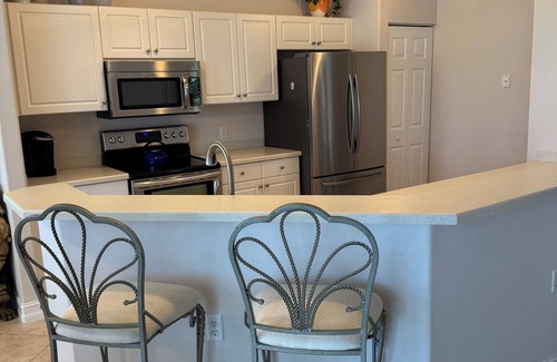 Estero Condo | Luxury Living in Pelican Sound Golf and River Club - Second Story Coach Home