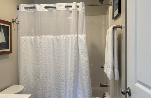 Elizabethtown Resort | Luxury Lodging, Lakefront View, King Bed w/Private Bath, Private Patio.