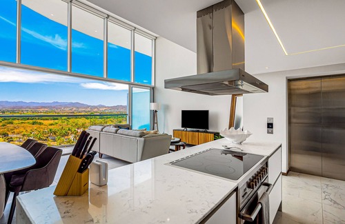 Flamingos Condo | Luxury ocean-view condo with resort pool, private balcony, and washer/dryer