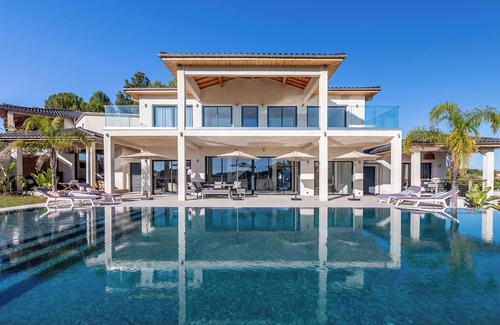 Plaissan Villa | Luxury SCL villa heated mirror pool exotic garden vineyard