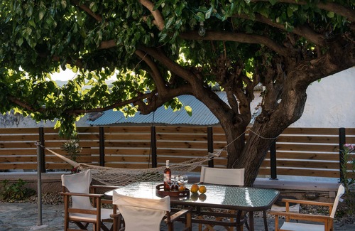 Psathoyiannos Cottage | Maro's village hall. Private & Serene Stone Villa