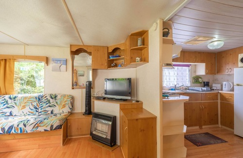 La Tremblade RV Rental | Mobile Home 'Mobilhome Mh343' with Shared Pool, Private Terrace and Private Garden
