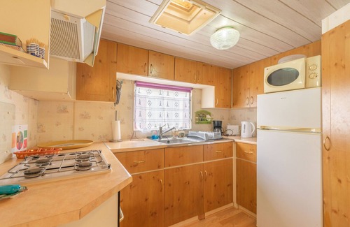 La Tremblade RV Rental | Mobile Home 'Mobilhome Mh343' with Shared Pool, Private Terrace and Private Garden