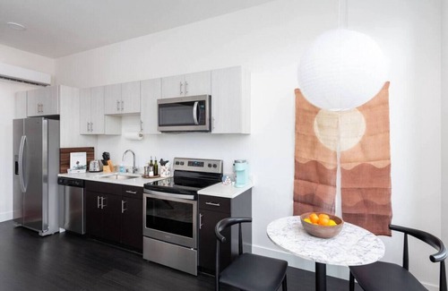 Westown Apartment | Modern 1BR Apt with Skywalk to Fiserv, Rooftop, and Parking