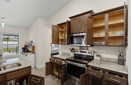 Palm Harbor House | Modern 4BR Retreat Near Beach + Heated Pool