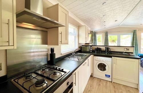 Broughton Mills House | Modern and contemporary lodge style holiday home set in woodland area.