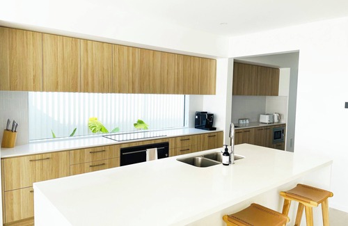 Pelican Waters House | Modern Boho Retreat with Pool, Yard & Beaches Just Minutes Away
