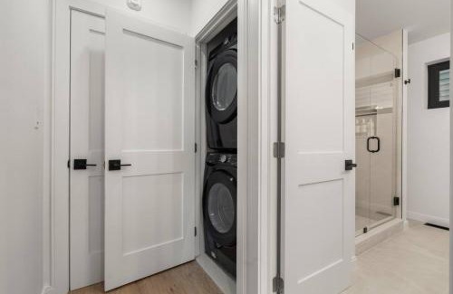 Jeffries Point Apartment | Modern Coastal City Stay Waterfront and Airport